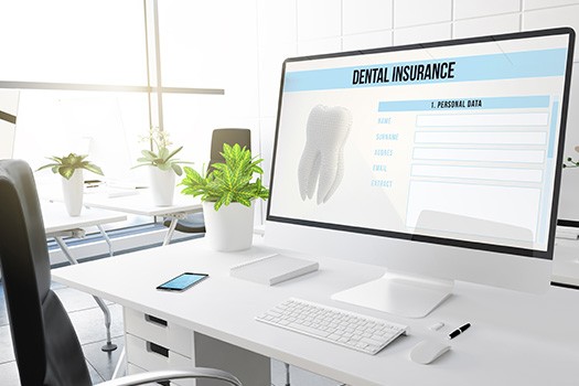 Dental insurance forms on desktop in office