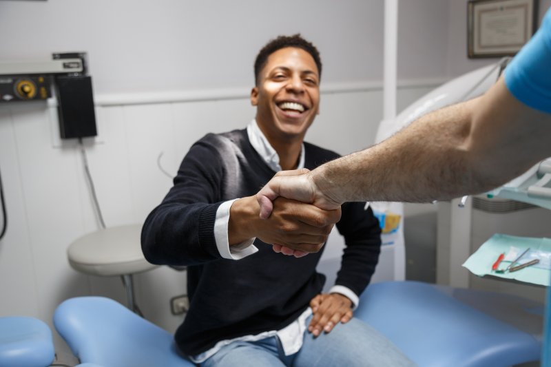 Patient smiling at their dentist