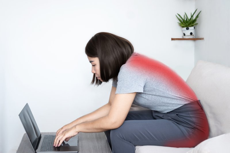 a woman feeling discomfort due to bad posture